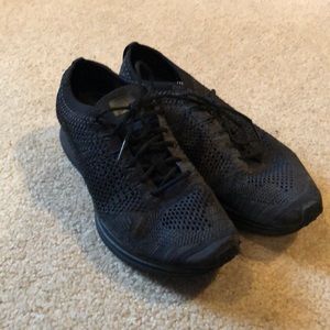 Nike black flyknit racers running shoe